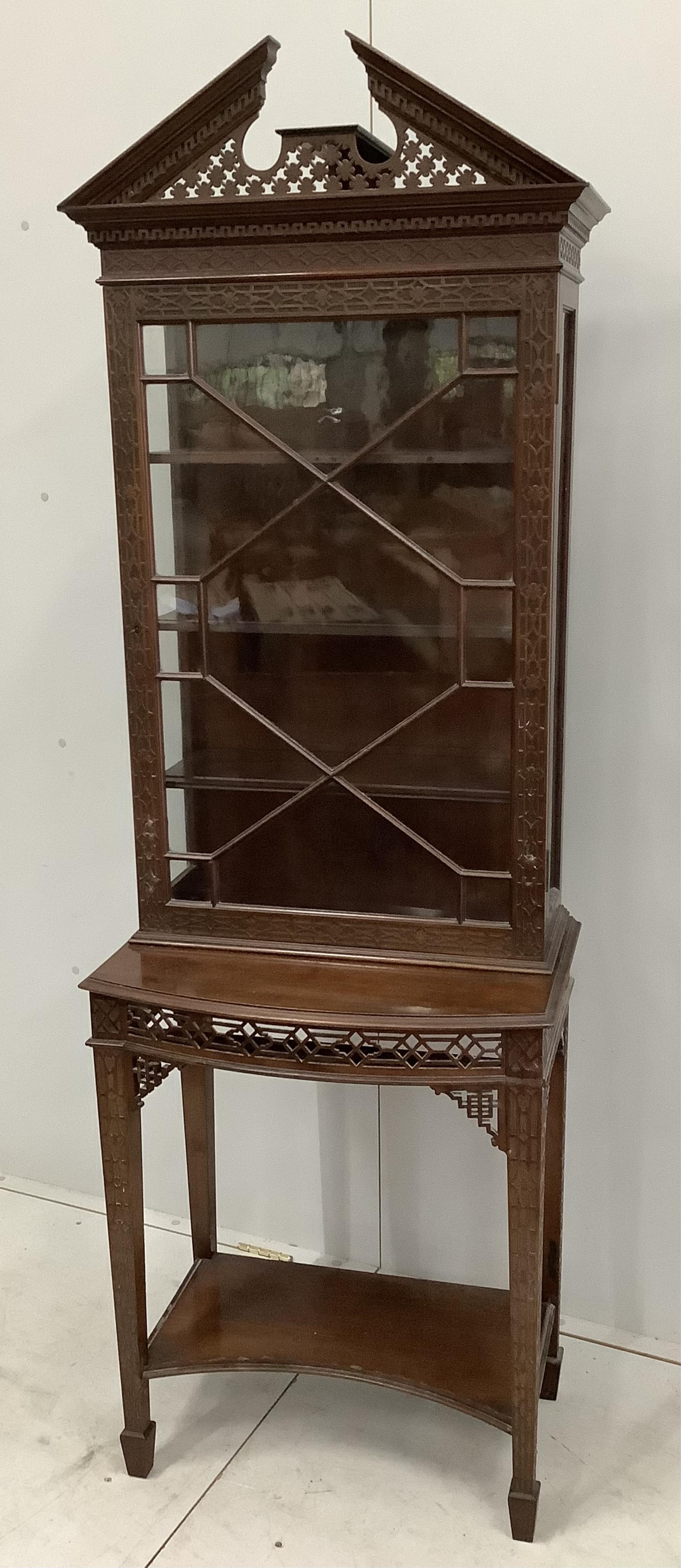 An Edwardian Chippendale Revival blind fret mahogany bow front display cabinet, width 62cm, depth 40cm, height 188cm. Condition - poor